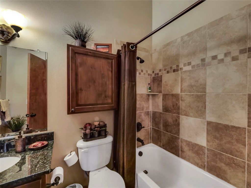 3710 Ryan Gulch Road, Unit 3710 Silverthorne, CO 80498 - Photo 26 of 50 a bathroom with a sink a toilet and shower