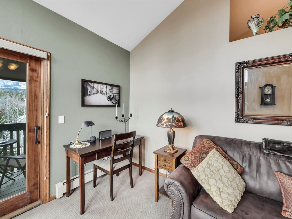 3710 Ryan Gulch Road, Unit 3710 Silverthorne, CO 80498 - Photo 6 of 50 a living room with furniture and a wooden floor