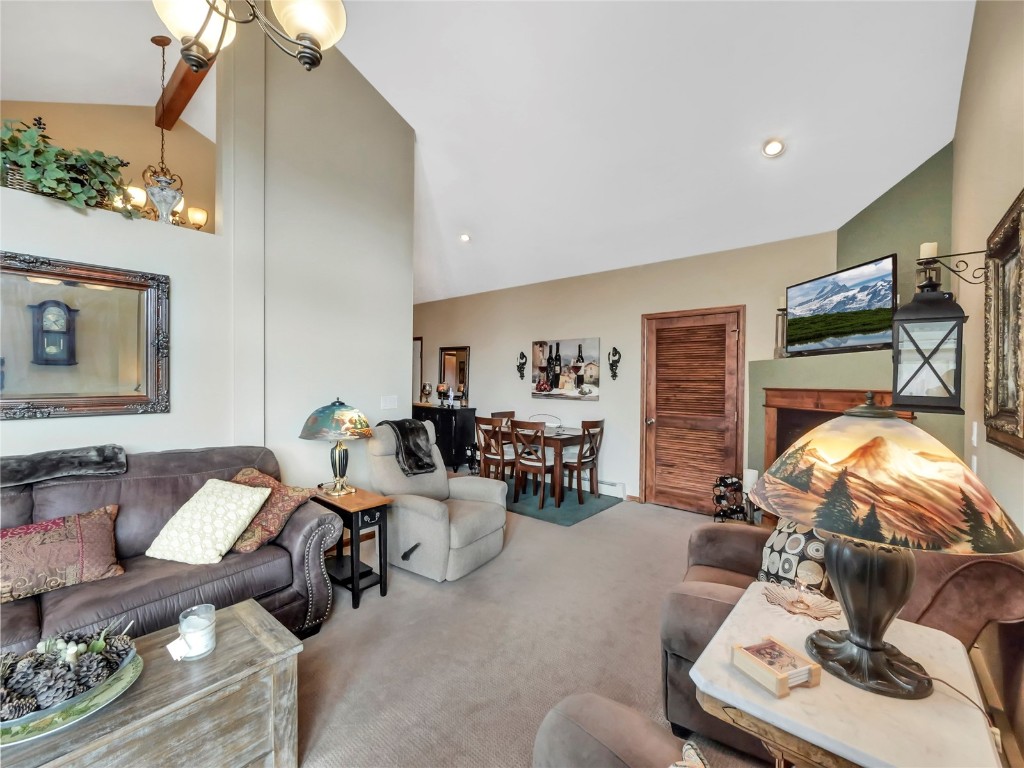 3710 Ryan Gulch Road, Unit 3710 Silverthorne, CO 80498 - Photo 9 of 50 a living room with furniture and a flat screen tv
