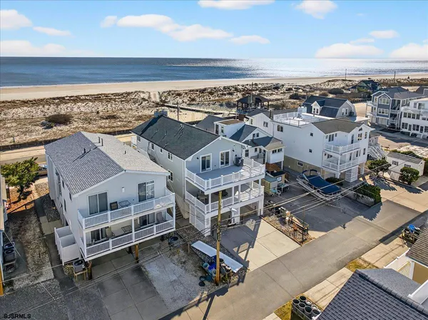 an aerial view of a house with a ocean view