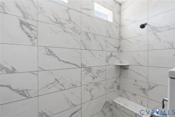 a bathroom with a sink double vanity and a shower