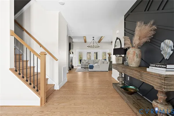 a view of an entryway with wooden floor