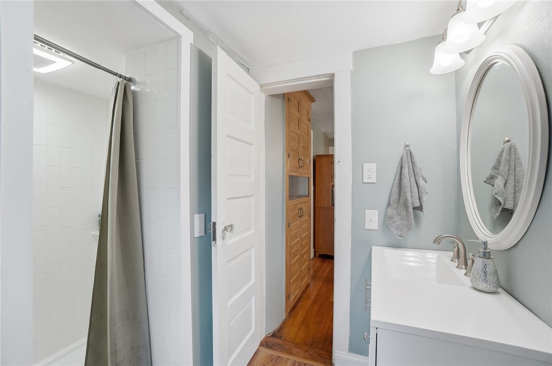 6155 North Union Road Clayton, OH 45315 - Photo 26 of 59 This bright bathroom offers a pristine shower and a stylish vanity with an elegant mirror.