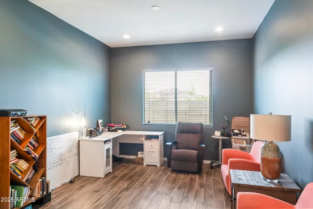 a bedroom with furniture and a window