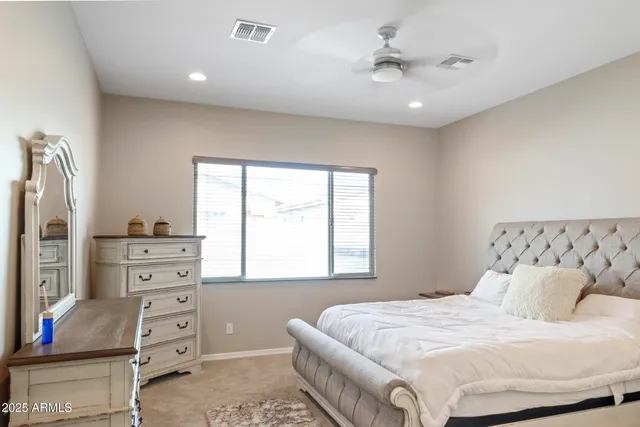 a bedroom with a bed and a dresser