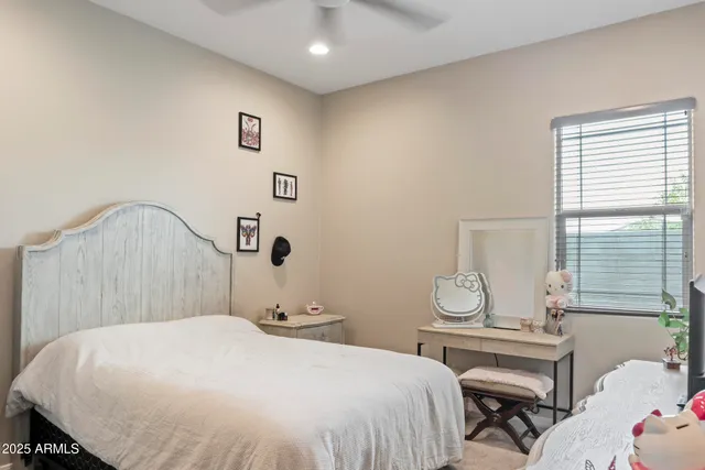 a bedroom with a bed and a table