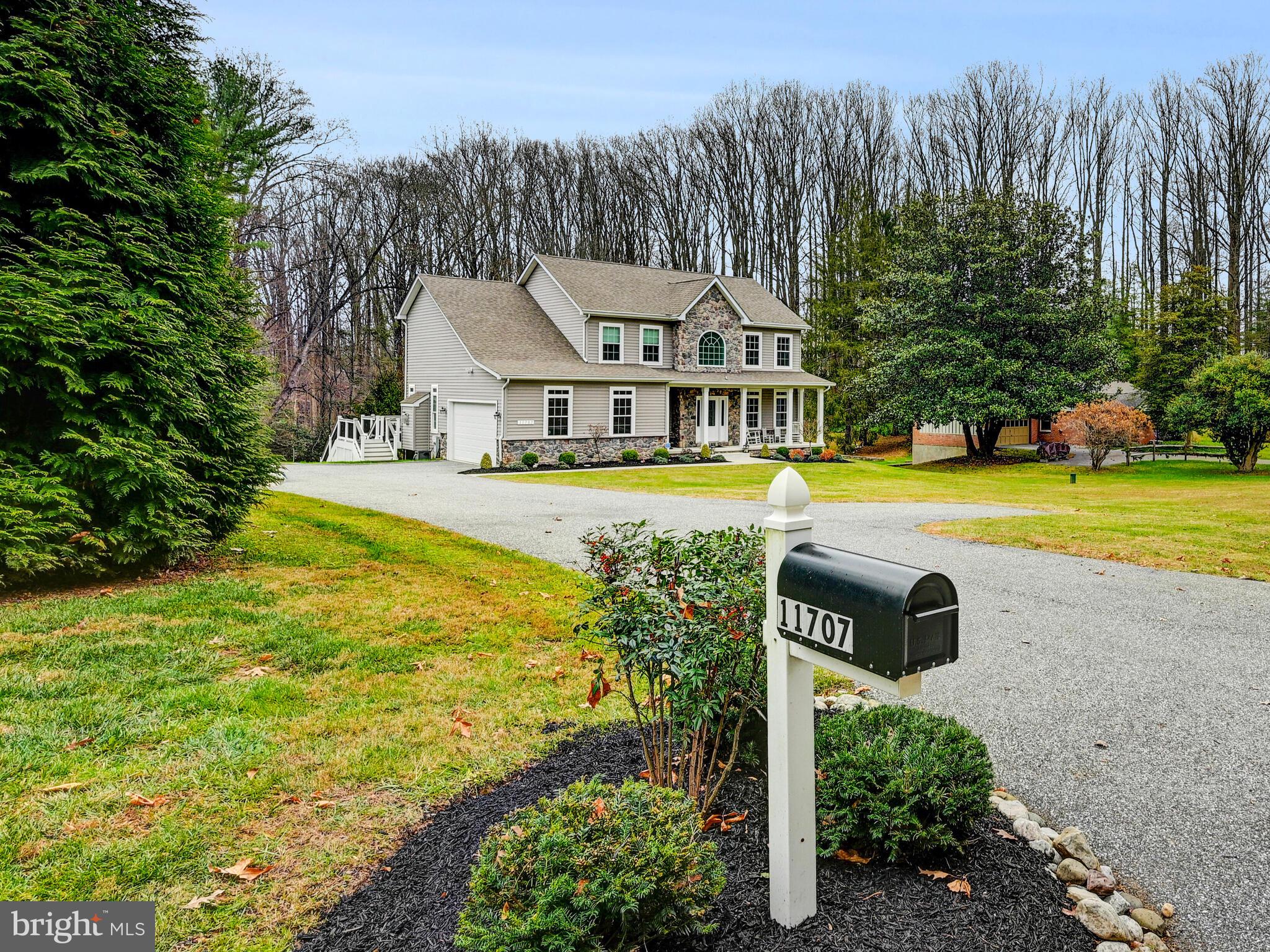 11707 Manor Road Glen Arm, MD 21057 - Photo 1 of 43 a front view of a house with swimming pool