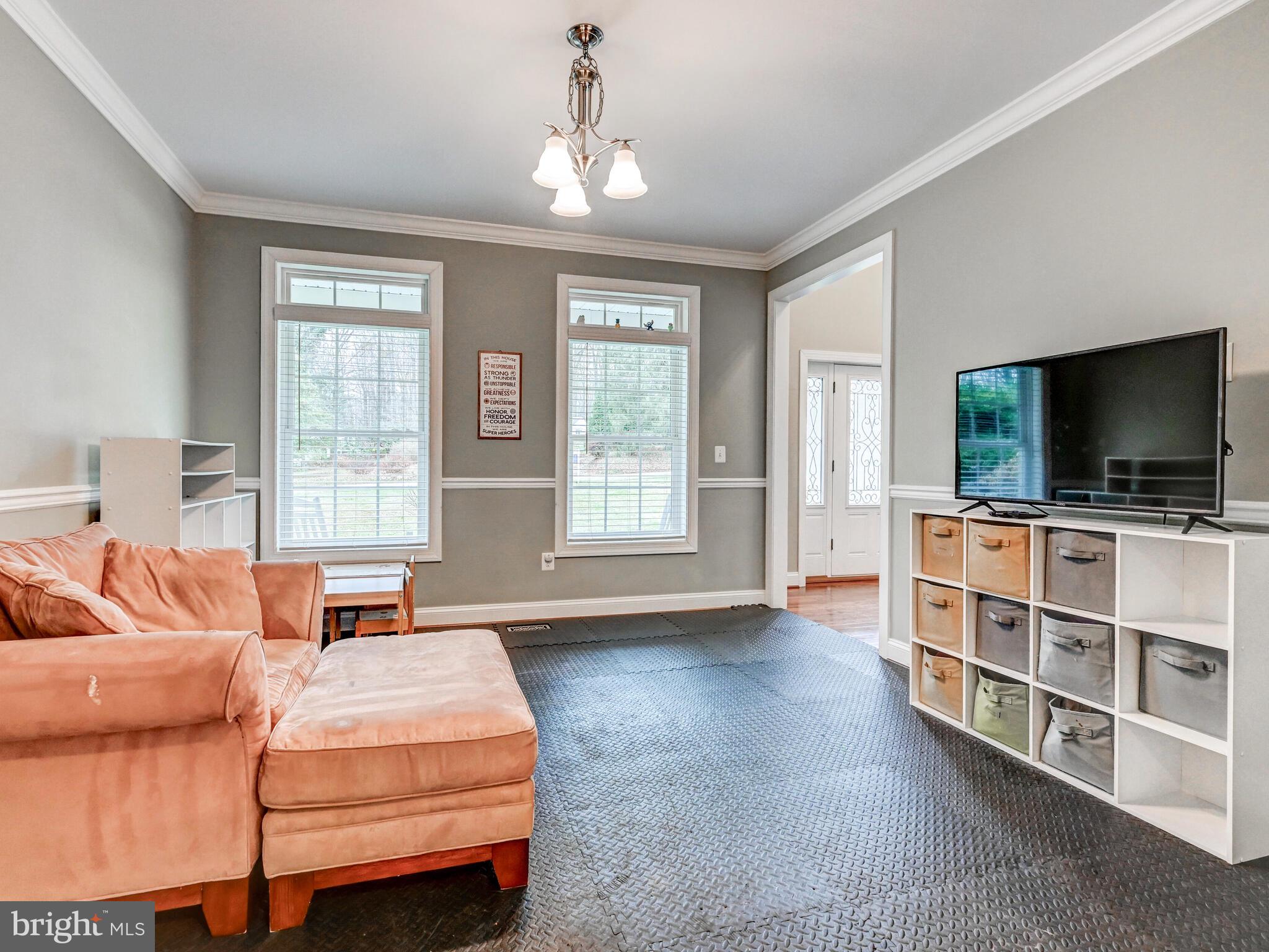 11707 Manor Road Glen Arm, MD 21057 - Photo 17 of 43 a bedroom with a bed and a flat screen tv