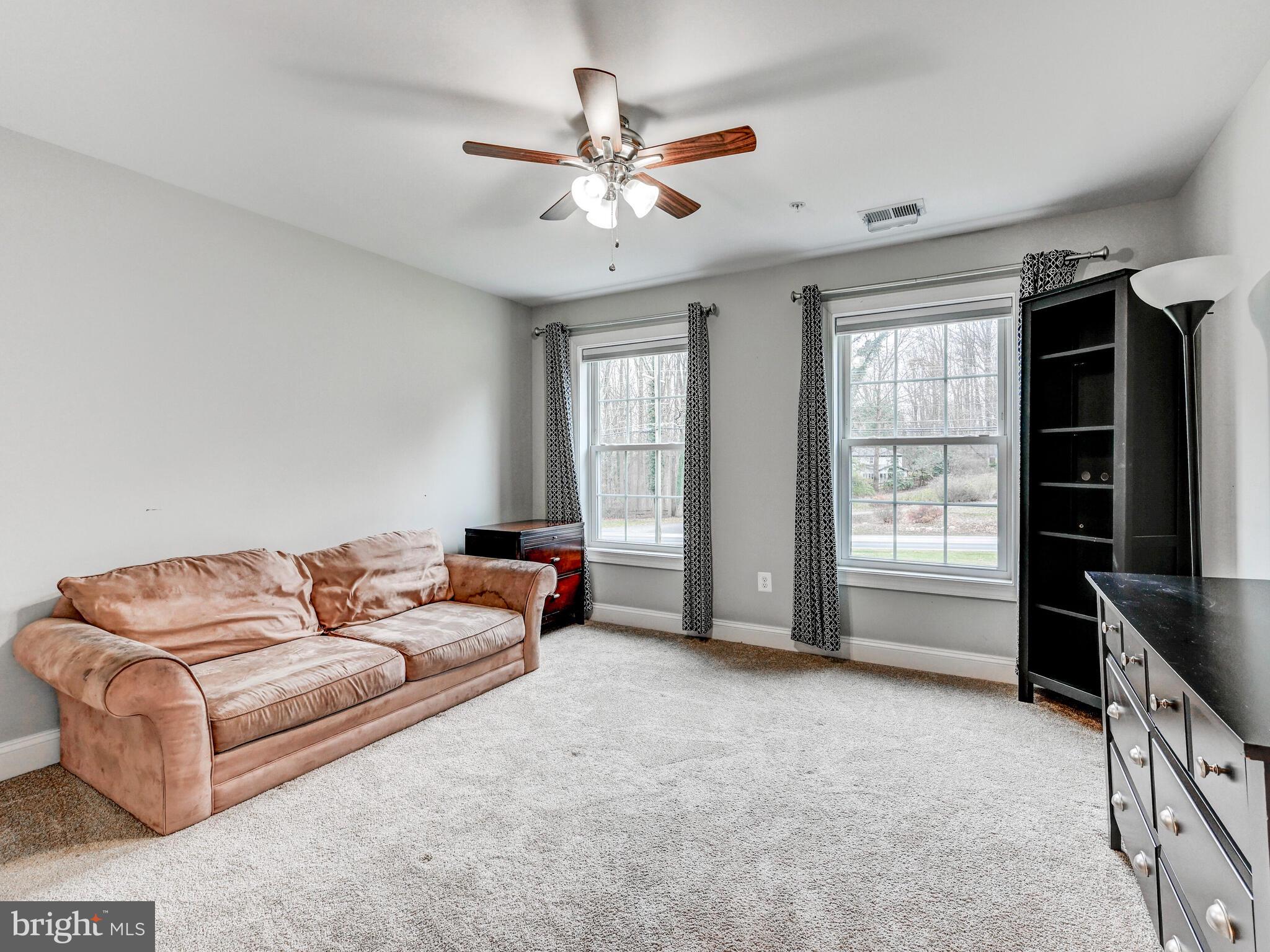 11707 Manor Road Glen Arm, MD 21057 - Photo 19 of 43 a living room with furniture and windows