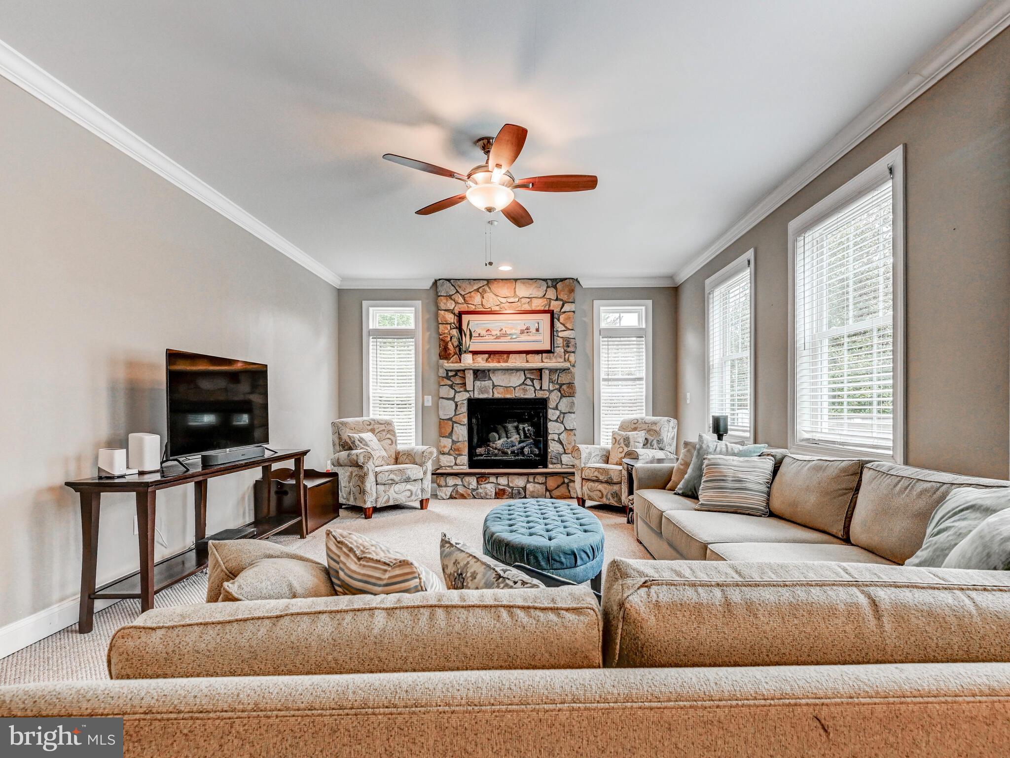 11707 Manor Road Glen Arm, MD 21057 - Photo 21 of 43 a living room with furniture flat screen tv and a fireplace