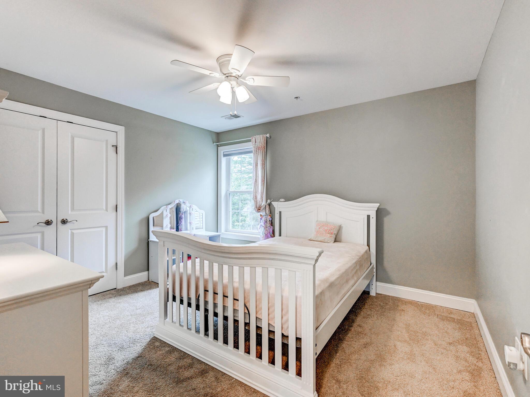 11707 Manor Road Glen Arm, MD 21057 - Photo 31 of 43 a bedroom with a bed and a chandelier