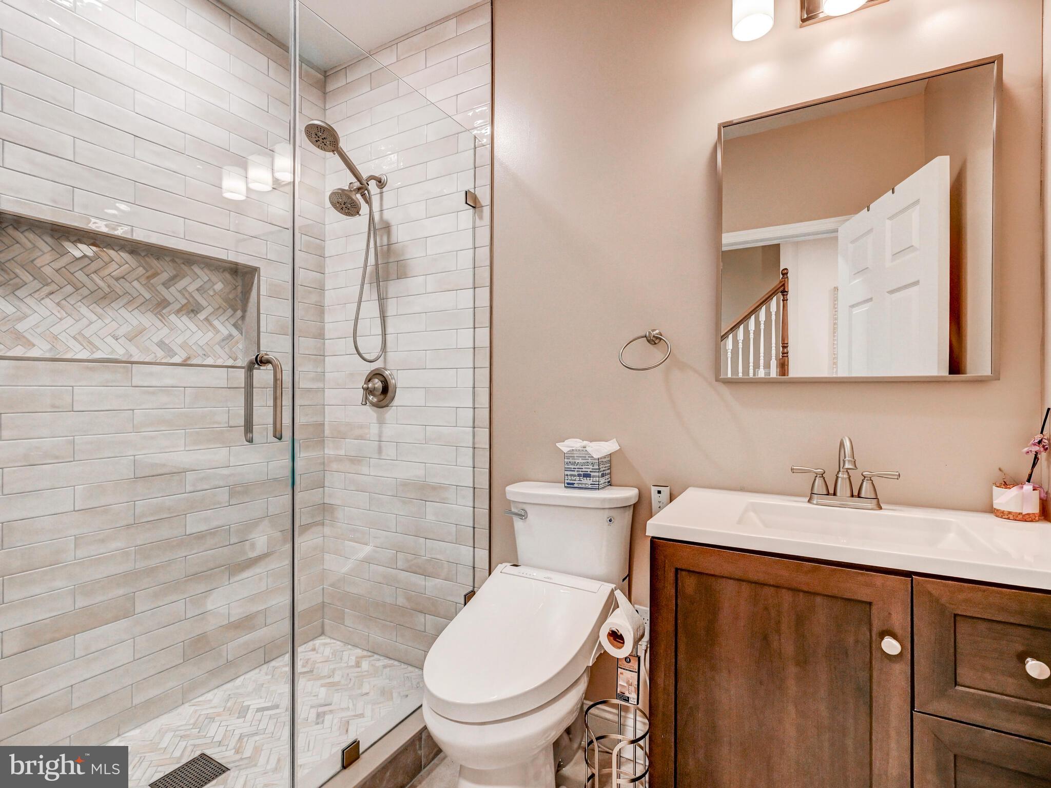 11707 Manor Road Glen Arm, MD 21057 - Photo 35 of 43 a bathroom with a toilet sink and shower