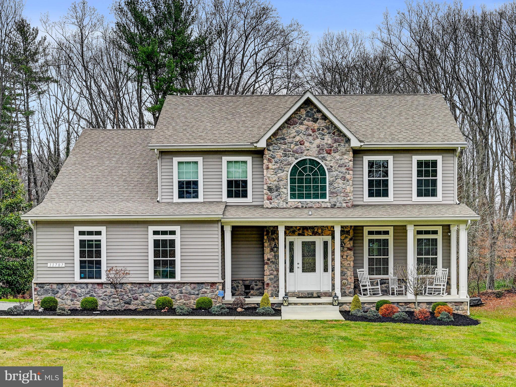 11707 Manor Road Glen Arm, MD 21057 - Photo 4 of 43 a front view of house with yard and trees in the background
