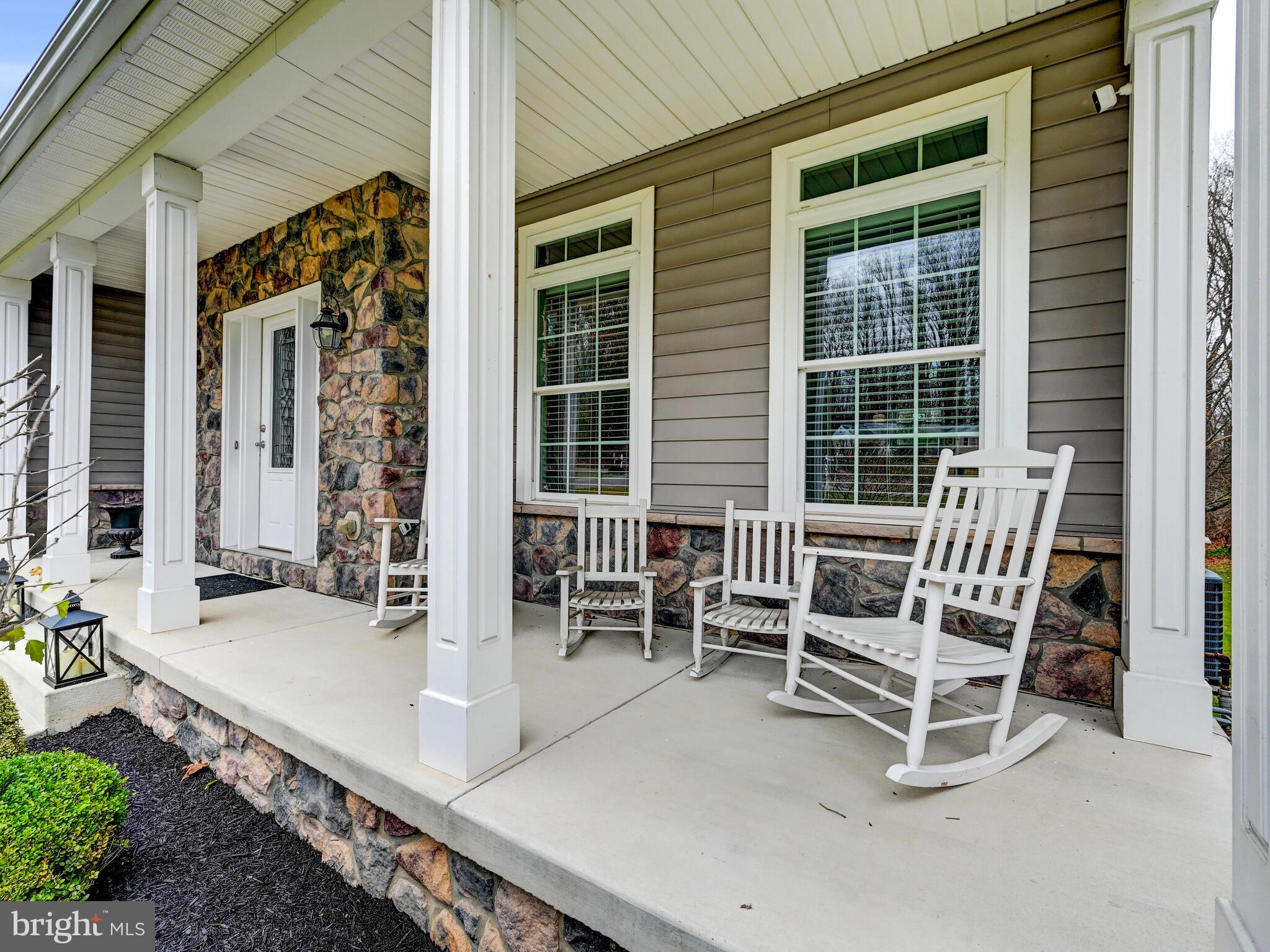 11707 Manor Road Glen Arm, MD 21057 - Photo 6 of 43 a view of a patio with a table and chairs
