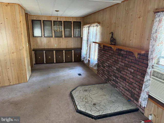 a view of a livingroom with furniture and staircase