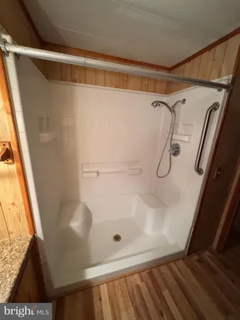 a bathroom with a glass shower door
