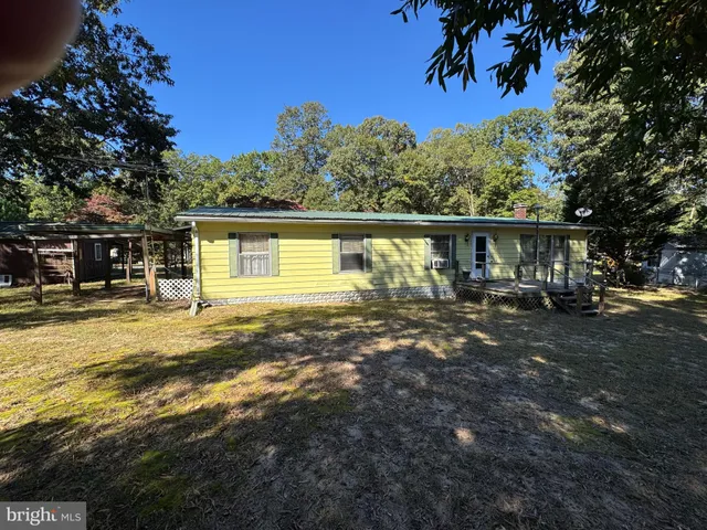 a view of a house with backyard balcony and garden