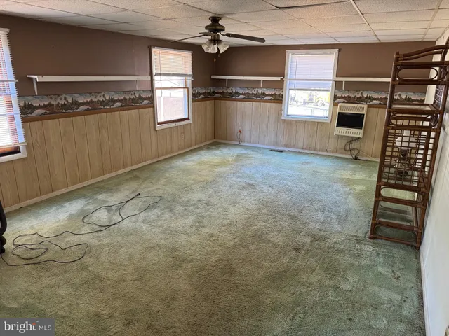 a kitchen with granite countertop a refrigerator and a stove