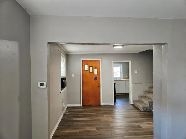a view of a livingroom from a hallway