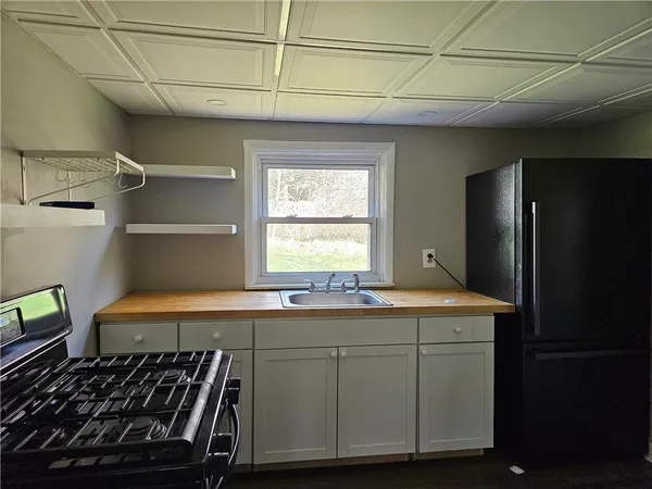 a kitchen with a stove and a refrigerator
