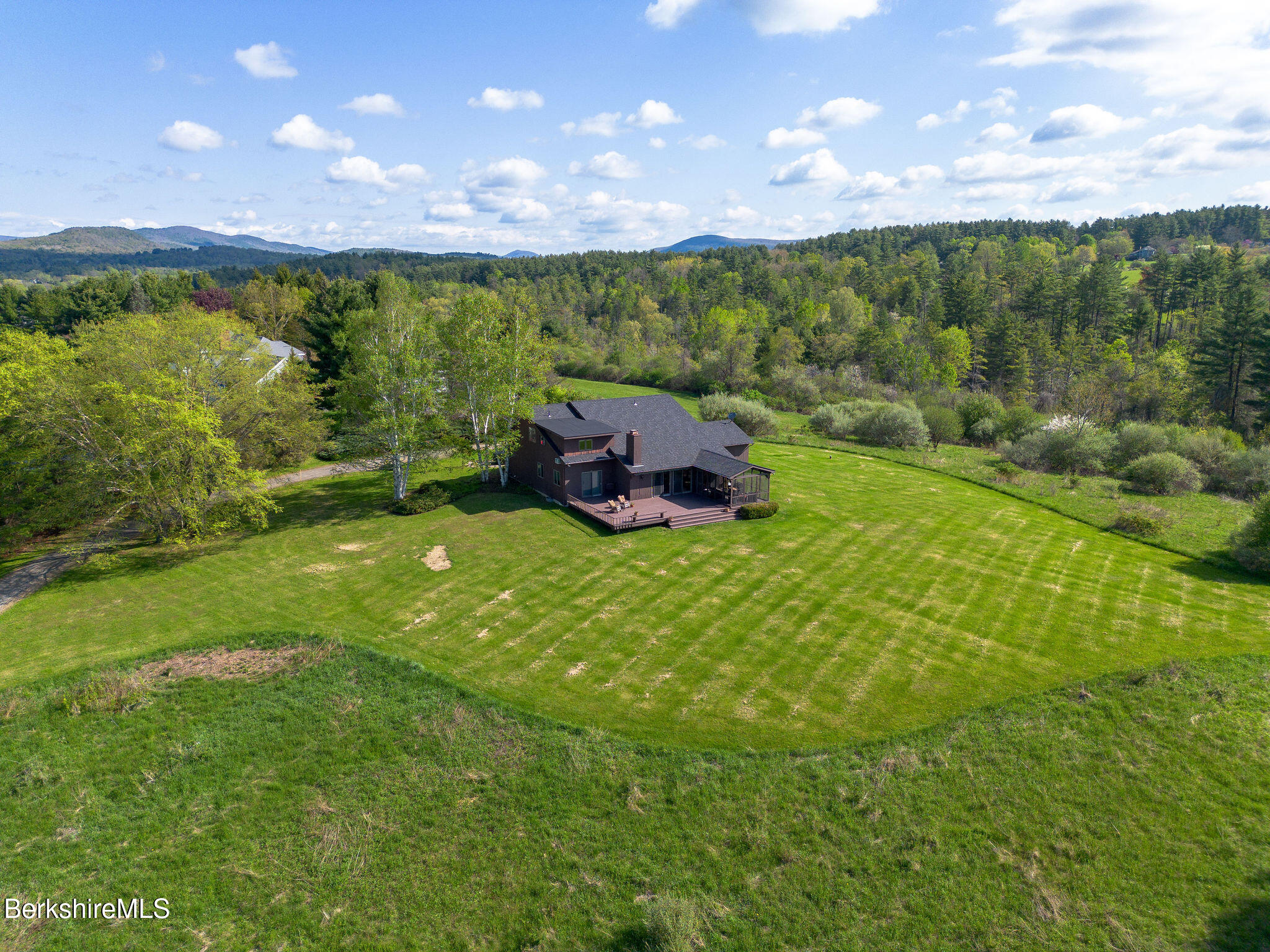 77 Hurlburt Road Great Barrington, MA 01230 - Photo 2 of 48 a view of a lake from a yard