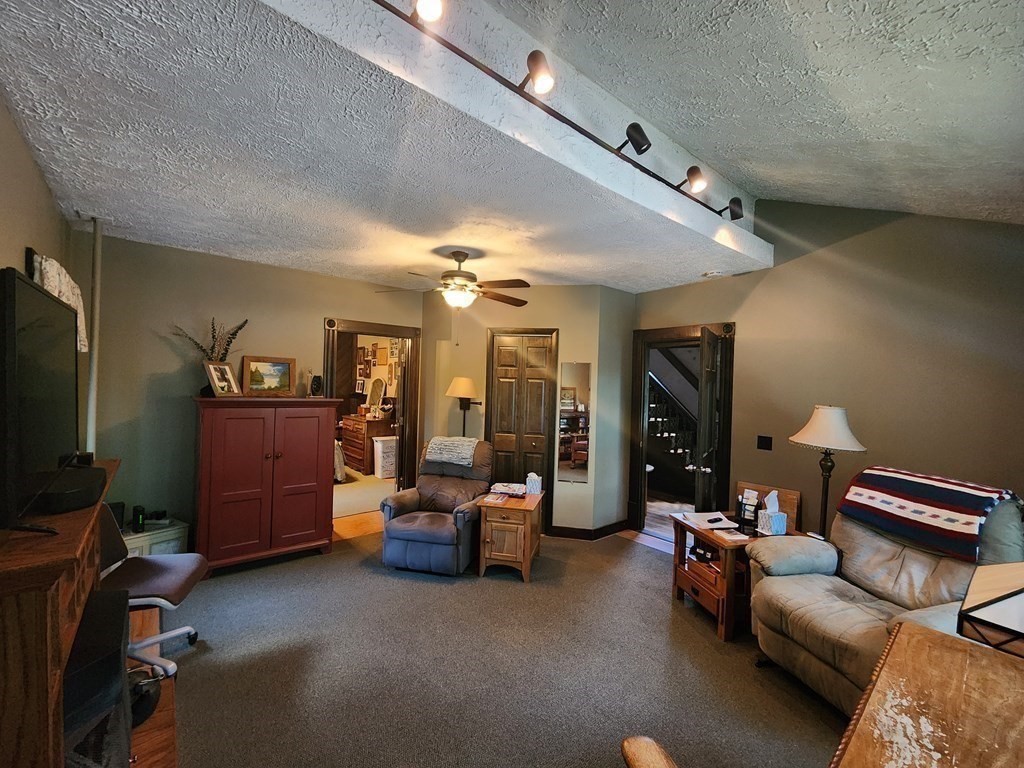 4 Sutton Place Worcester, MA 01603 - Photo 14 of 32 a living room with furniture and a flat screen tv