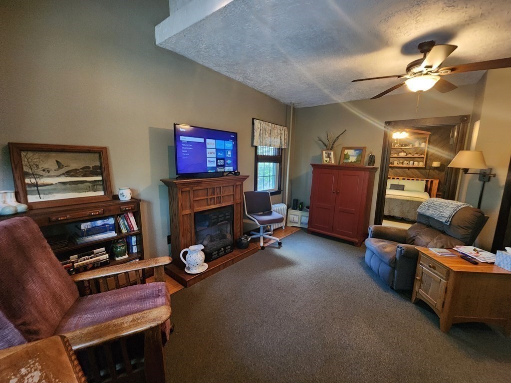4 Sutton Place Worcester, MA 01603 - Photo 15 of 32 a living room with furniture and a fireplace