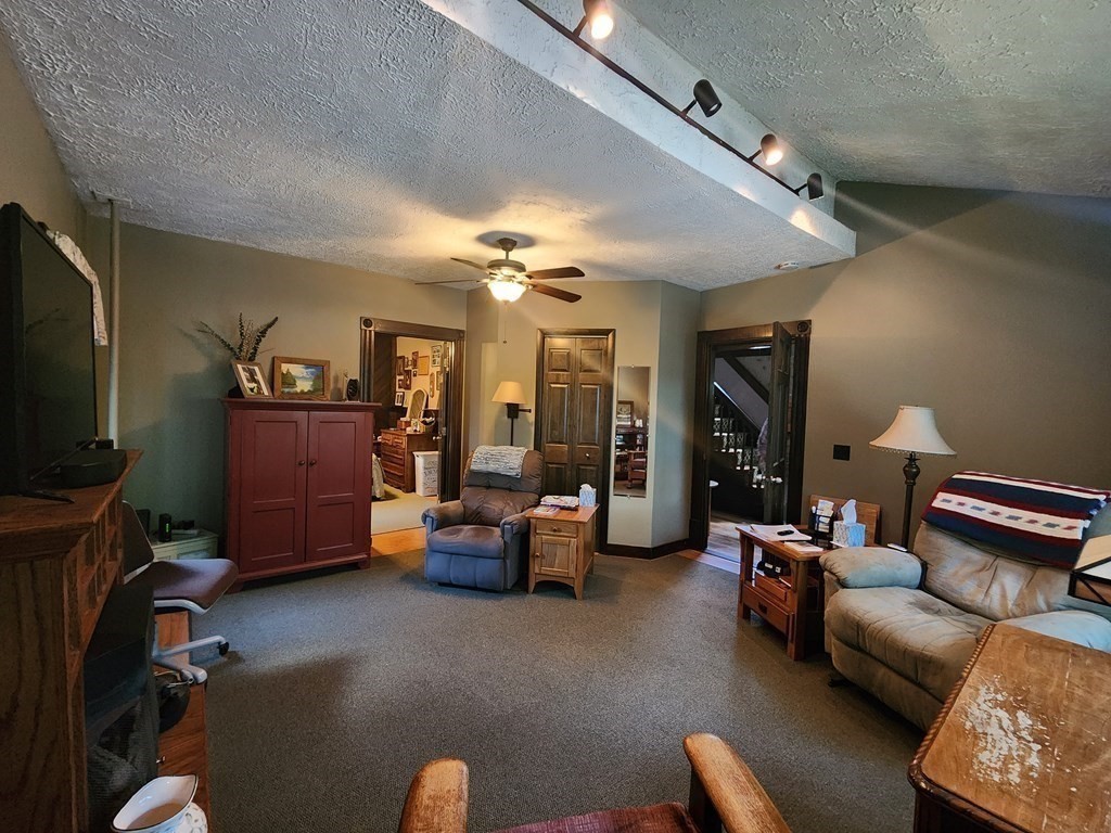 4 Sutton Place Worcester, MA 01603 - Photo 16 of 32 a living room with furniture and a flat screen tv