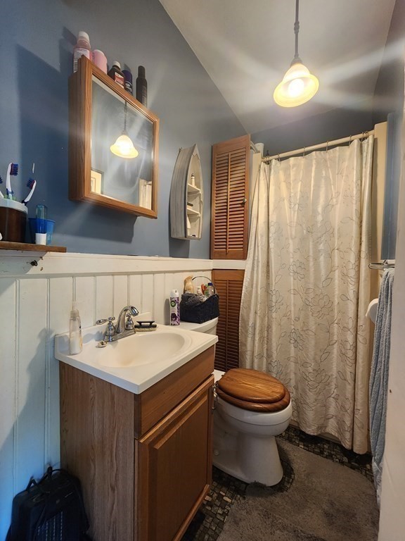 4 Sutton Place Worcester, MA 01603 - Photo 18 of 32 a bathroom with a toilet sink and mirror