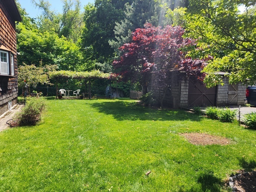 4 Sutton Place Worcester, MA 01603 - Photo 10 of 32 a view of a backyard with large trees