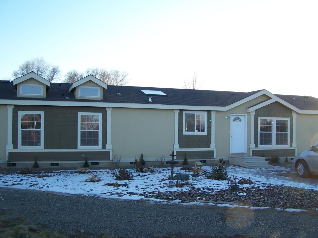 730 Durham Road Zillah, WA 98953 - Photo 1 of 11 a front view of a house with trees