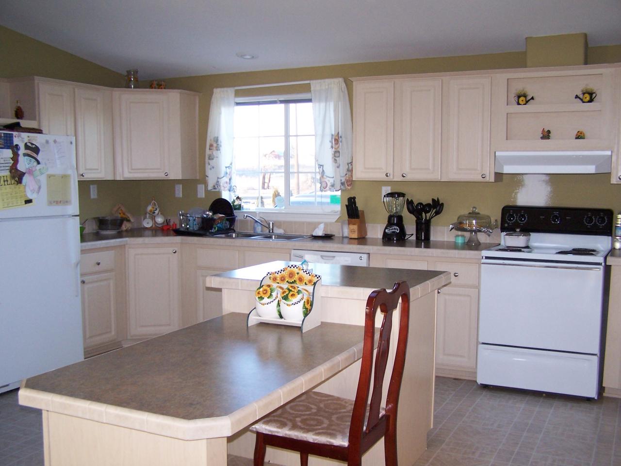 730 Durham Road Zillah, WA 98953 - Photo 2 of 11 a kitchen with stainless steel appliances granite countertop a stove a refrigerator a sink a stove and white cabinets with wooden floor