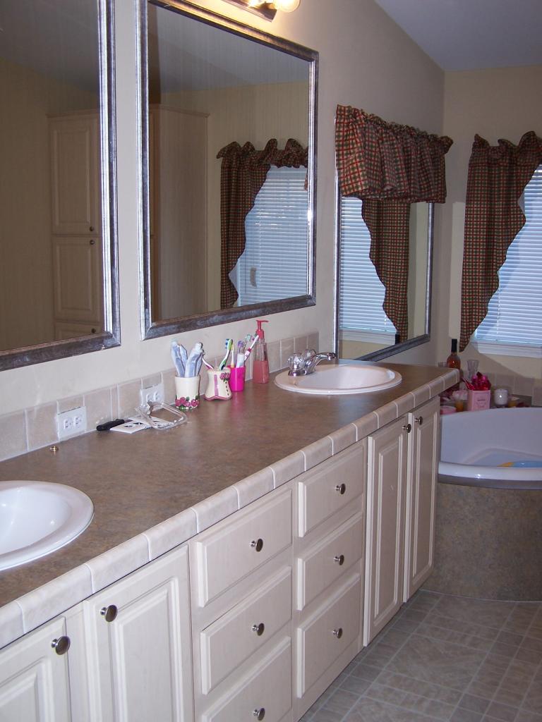 730 Durham Road Zillah, WA 98953 - Photo 8 of 11 a bathroom with a granite countertop sink vanity and a mirror