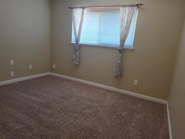 a kitchen with stainless steel appliances a stove sink and cabinets