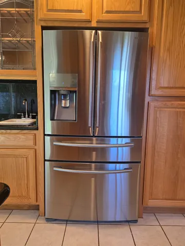 a stove top oven sitting inside of a kitchen