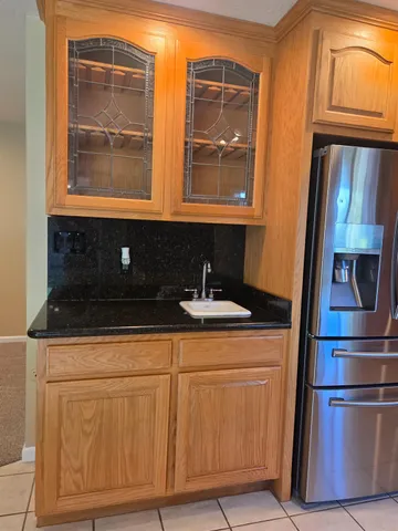 a kitchen with stainless steel appliances granite countertop a stove and a refrigerator