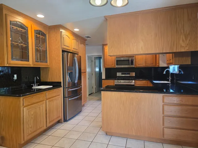 a white toilet sitting next to a window