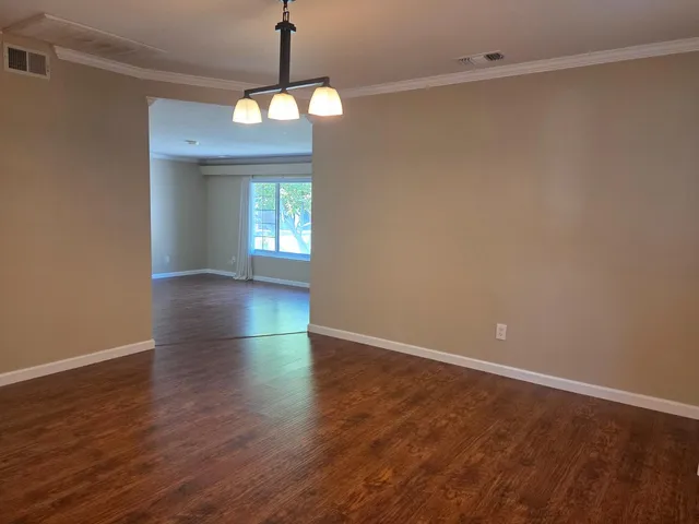 a view of kitchen with microwave and refrigerator