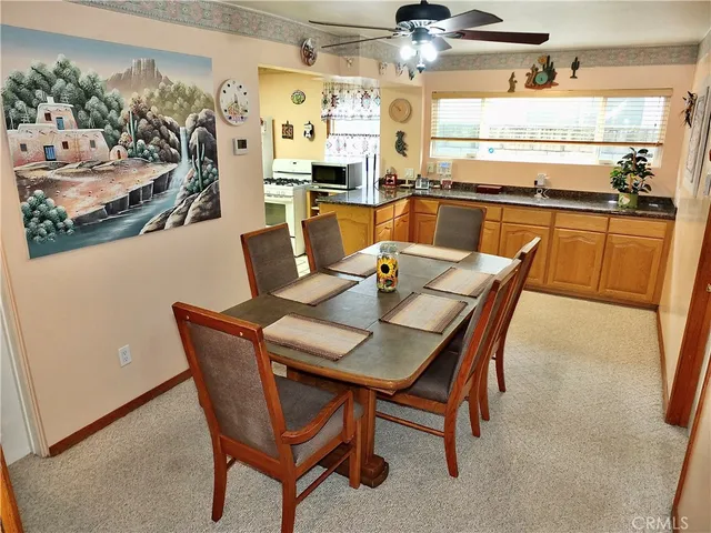 a kitchen with stainless steel appliances a sink a counter top space and a window
