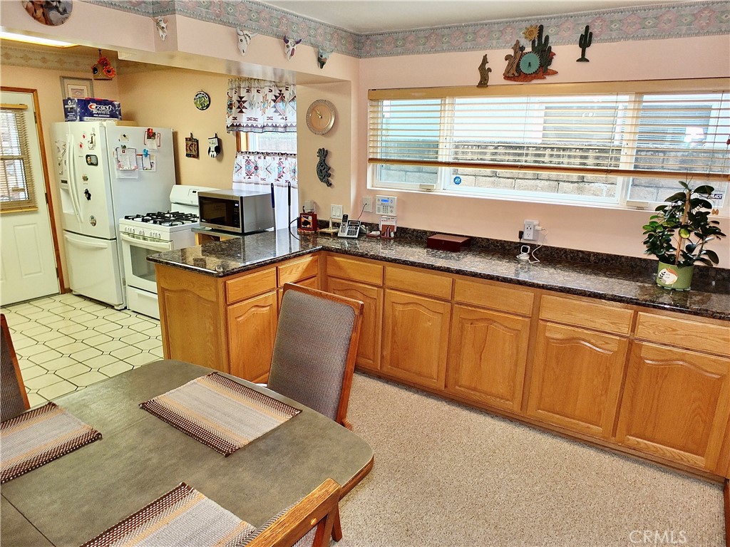 4907 139th Street Hawthorne, CA 90250 - Photo 17 of 47 a kitchen with stainless steel appliances a sink a counter top space and a window