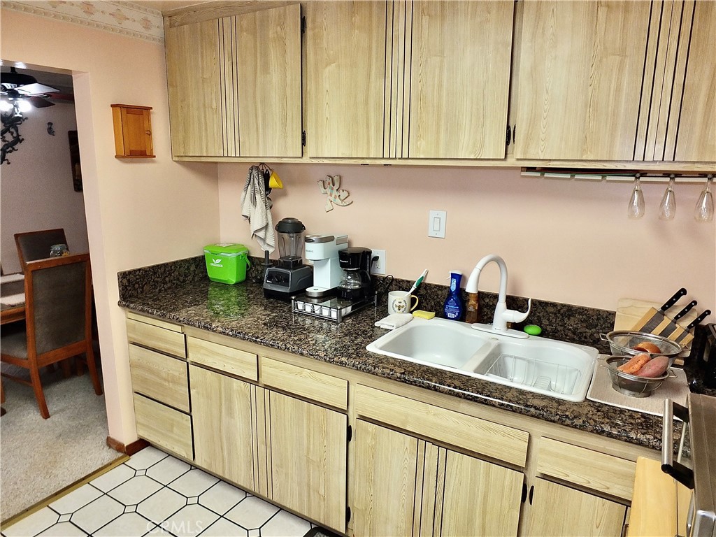 4907 139th Street Hawthorne, CA 90250 - Photo 25 of 47 a kitchen with granite countertop a sink a stove and cabinets