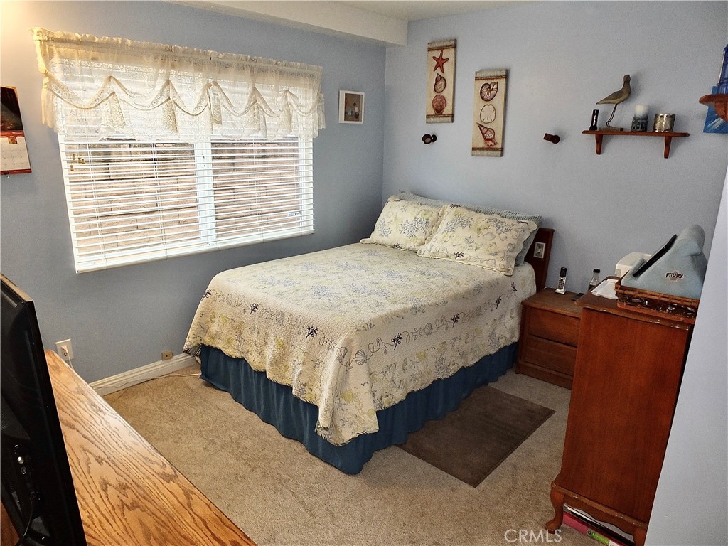 4907 139th Street Hawthorne, CA 90250 - Photo 27 of 47 a bed sitting in a bedroom next to a window