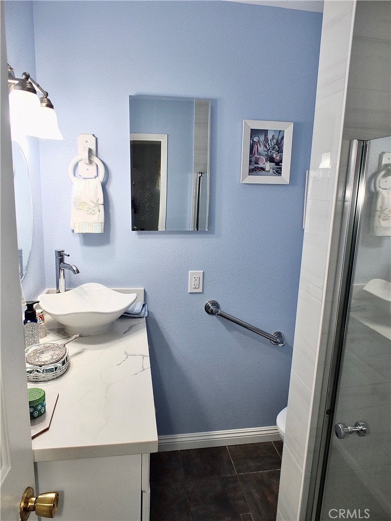 4907 139th Street Hawthorne, CA 90250 - Photo 28 of 47 a bathroom with a sink and mirror