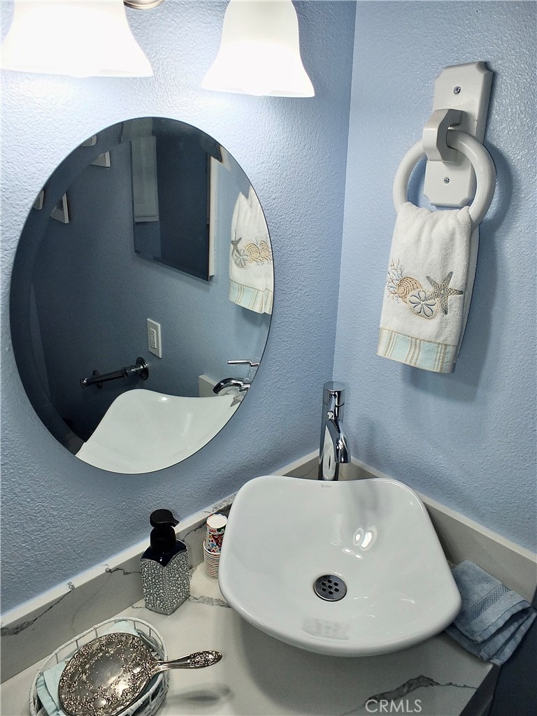 4907 139th Street Hawthorne, CA 90250 - Photo 30 of 47 a bathroom with a sink and mirror