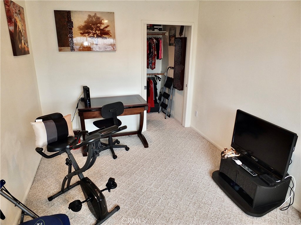 4907 139th Street Hawthorne, CA 90250 - Photo 35 of 47 a view of a workspace with furniture and a flat screen tv