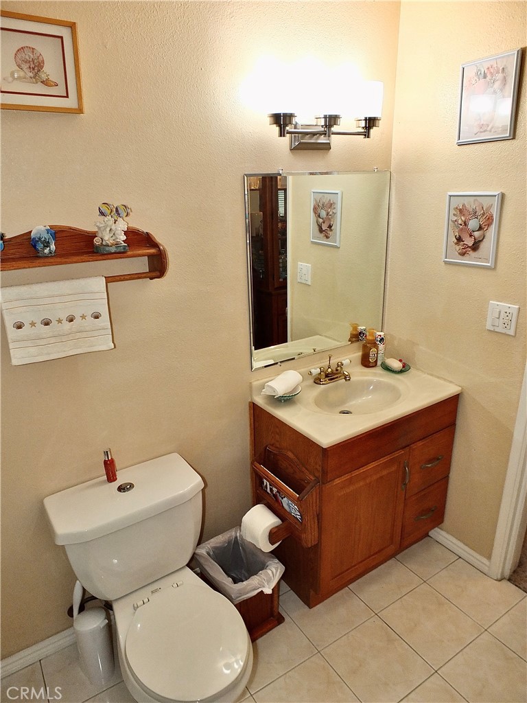 4907 139th Street Hawthorne, CA 90250 - Photo 39 of 47 a bathroom with a sink mirror and toilet