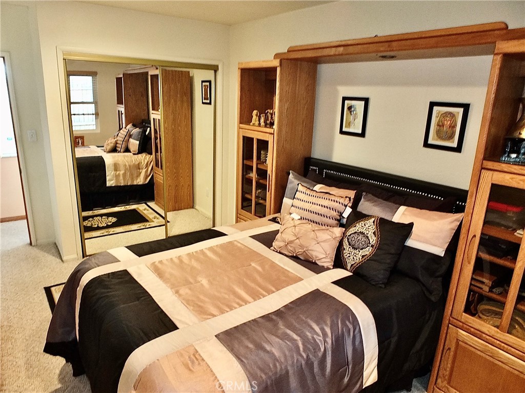 4907 139th Street Hawthorne, CA 90250 - Photo 6 of 47 a bedroom with a bed and glass door