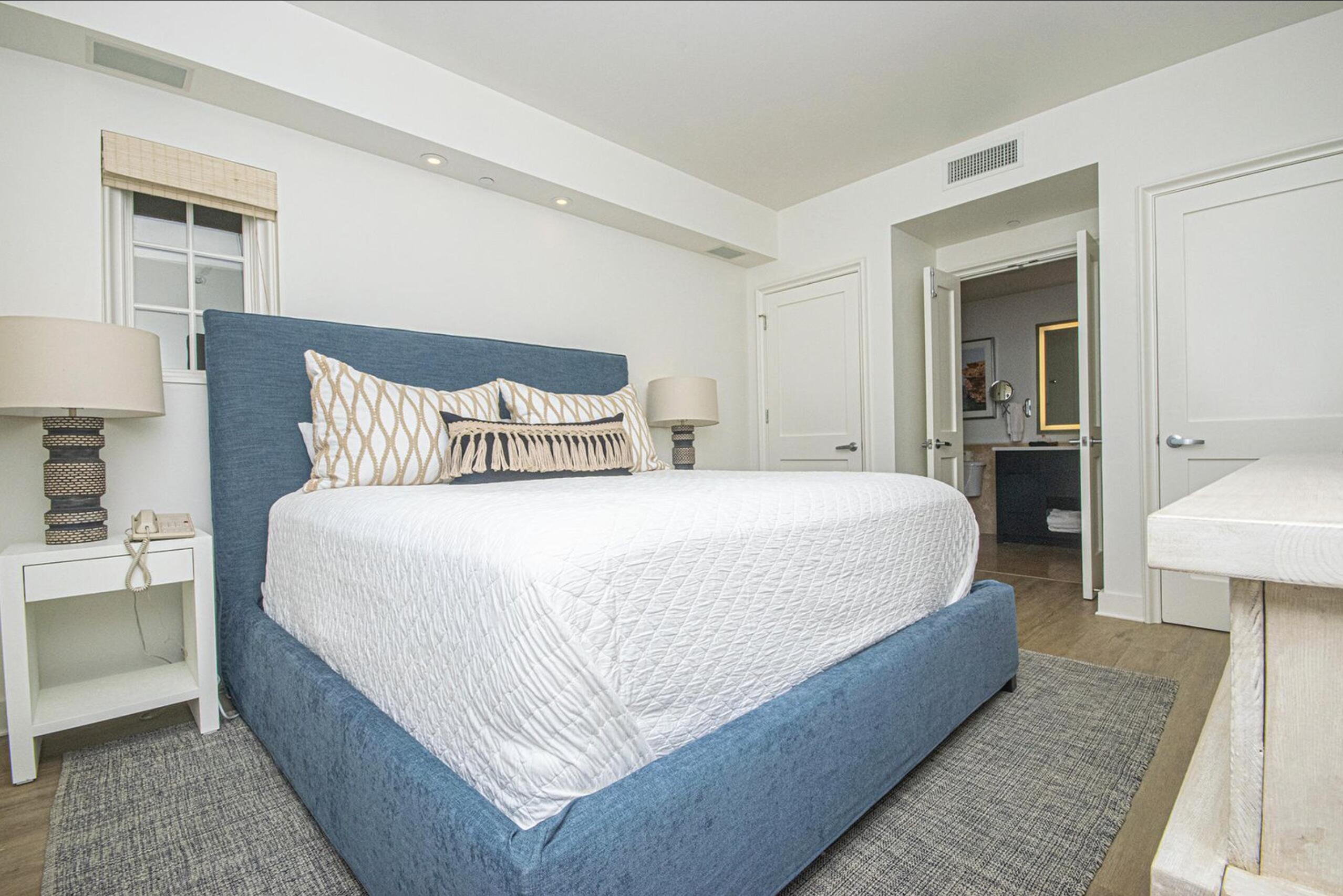 136 Georgetown Avenue, Unit 2B1 Inlet Beach, FL 32461 - Photo 15 of 21 a bed room with a bed and a lamp