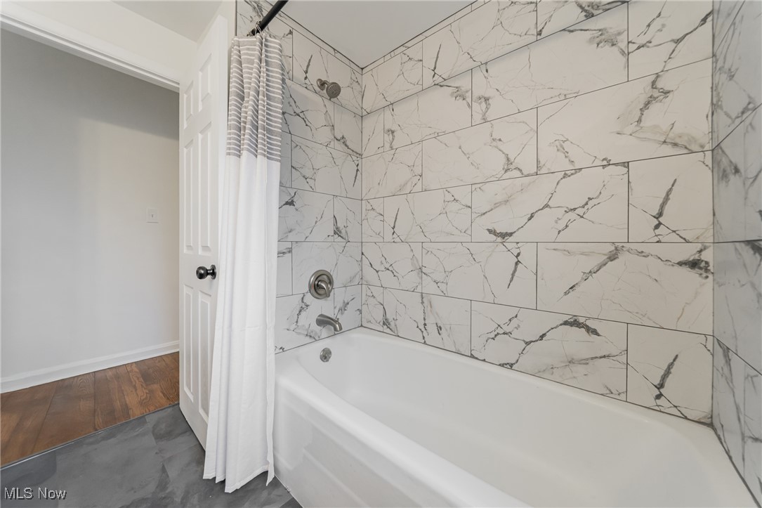 1391 Avondale Road Cleveland, OH 44121 - Photo 33 of 46 Full bath with baseboards and shower / bath combination with curtain