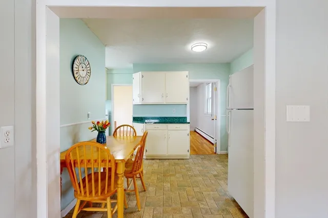 a kitchen with a table and chairs in it